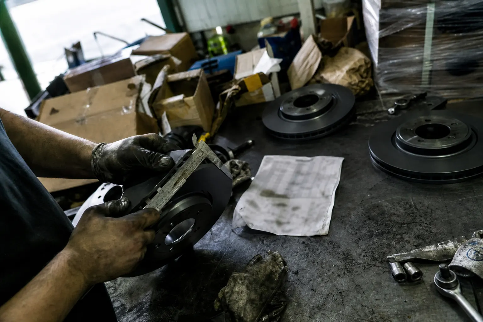 Wholesale coated brake rotors being checked against vehicle application records
